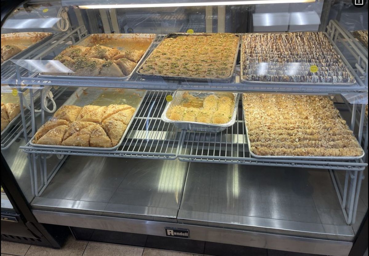 Trays of fresh baklava in the bakery case