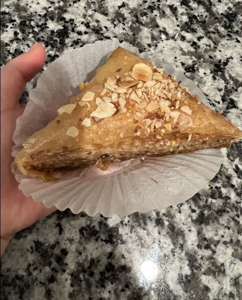 Baklava triangle topped with sliced almonds