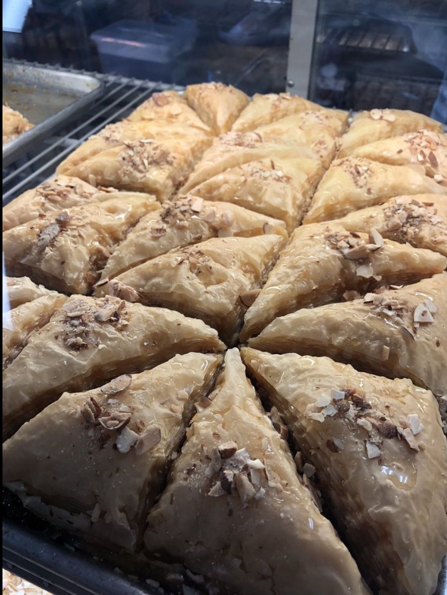 Tray of honey-soaked baklava triangles